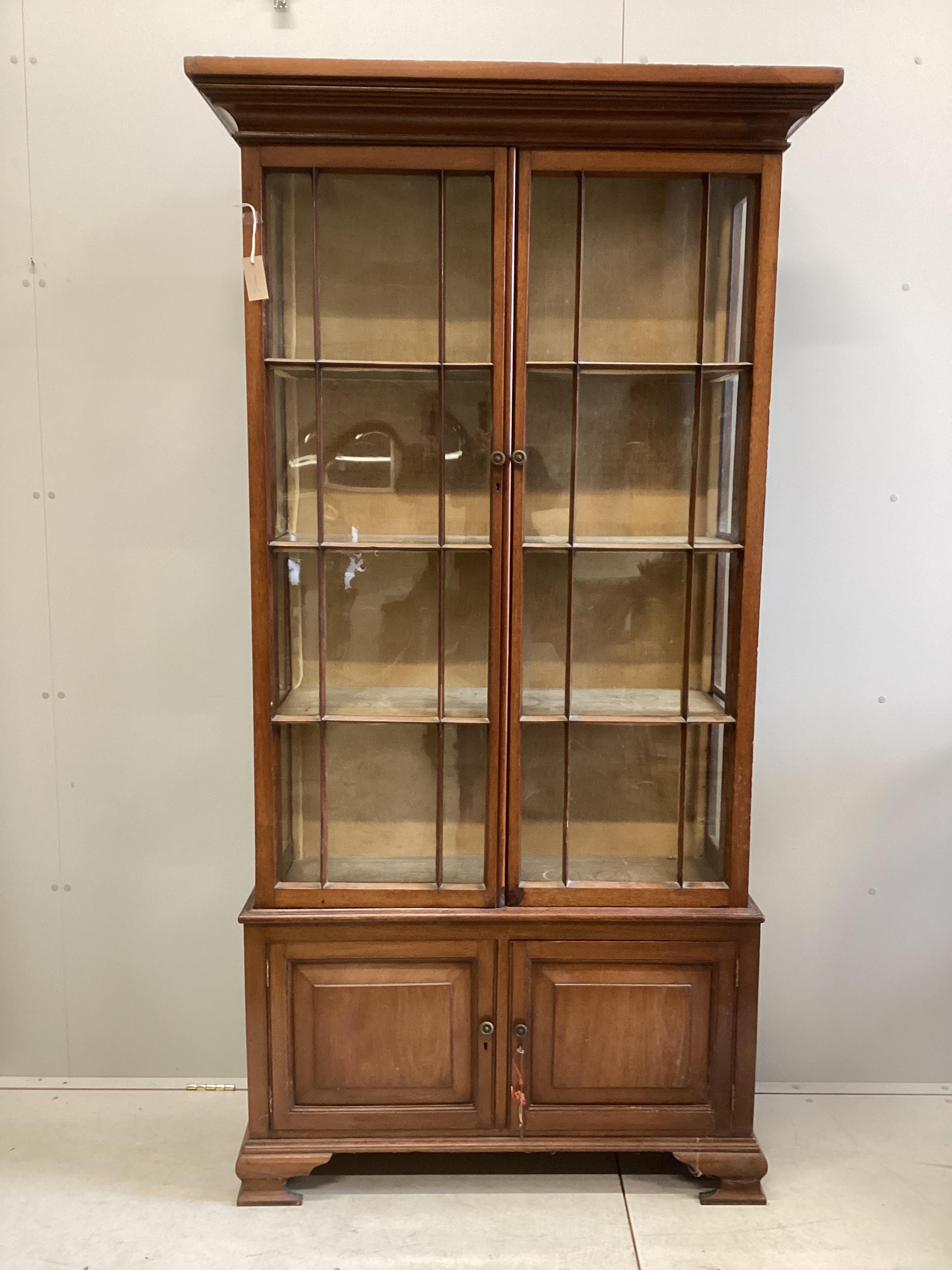 An Edwardian mahogany display cabinet, width 106cm, depth 39cm, height 203cm